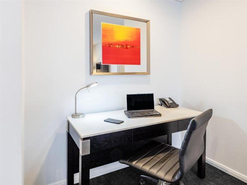 Meriton Suites Zetland Сидни Екстериор снимка A work desk in a hotel room
